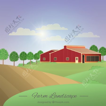 阳光灿烂的一天里有一座谷仓的农场景观