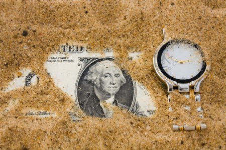 沙子里的美元与手表图片