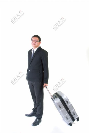 拉旅游箱的商务男人图片
