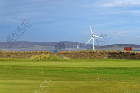高尔夫高尔夫球场绿色国旗风力发电机组墙景区当然草