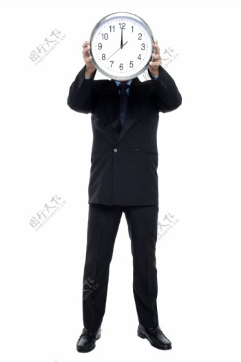 拿着钟表的男人图片